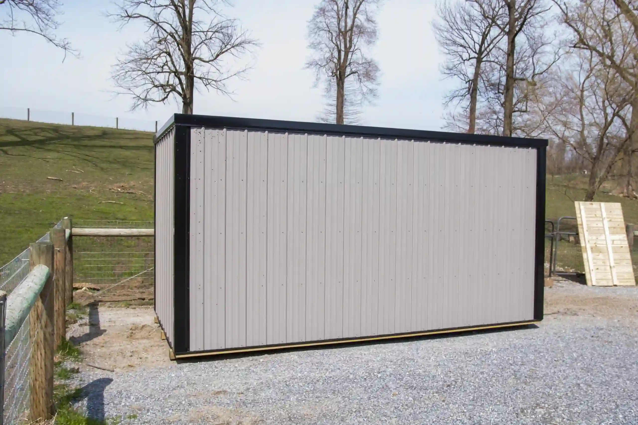 The clean lines and durable, low-maintenance vertical metal siding on a modern storage shed from Mill Run Storage.
