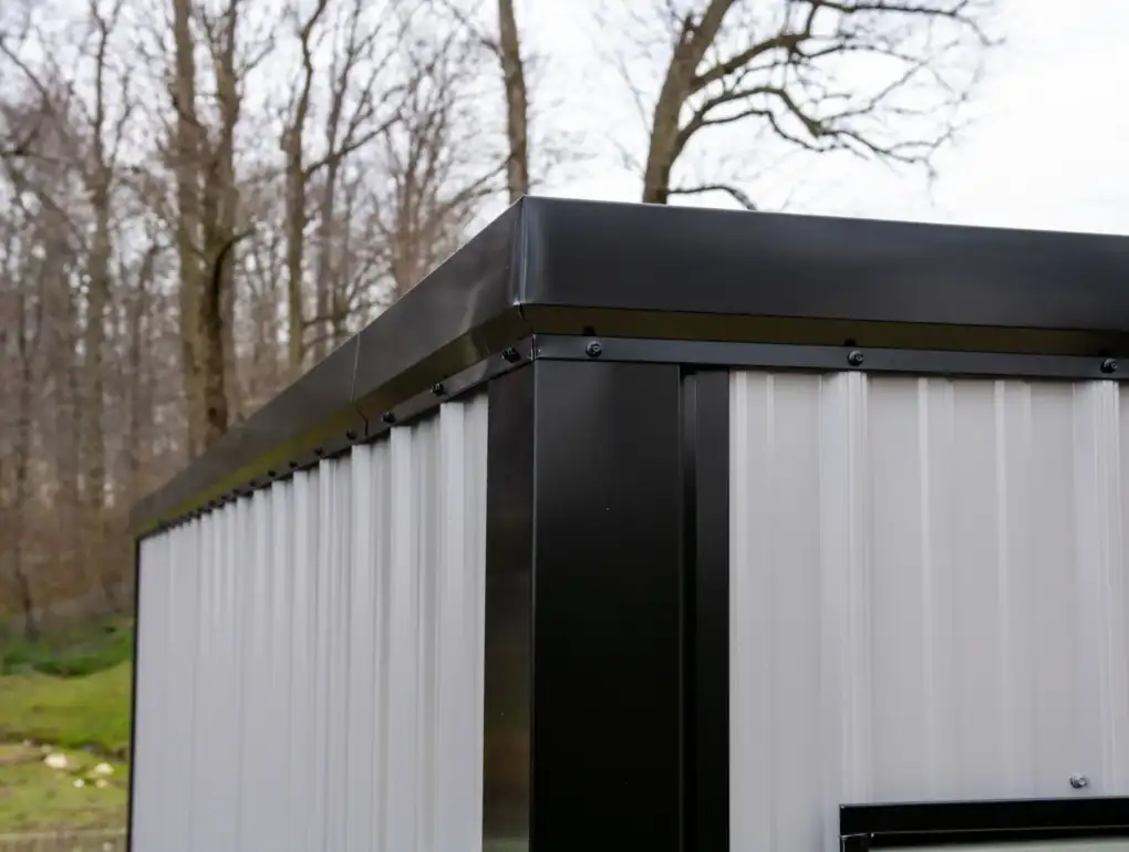 A close-up of the clean, durable corner construction and vertical metal siding on a modern portable storage container.