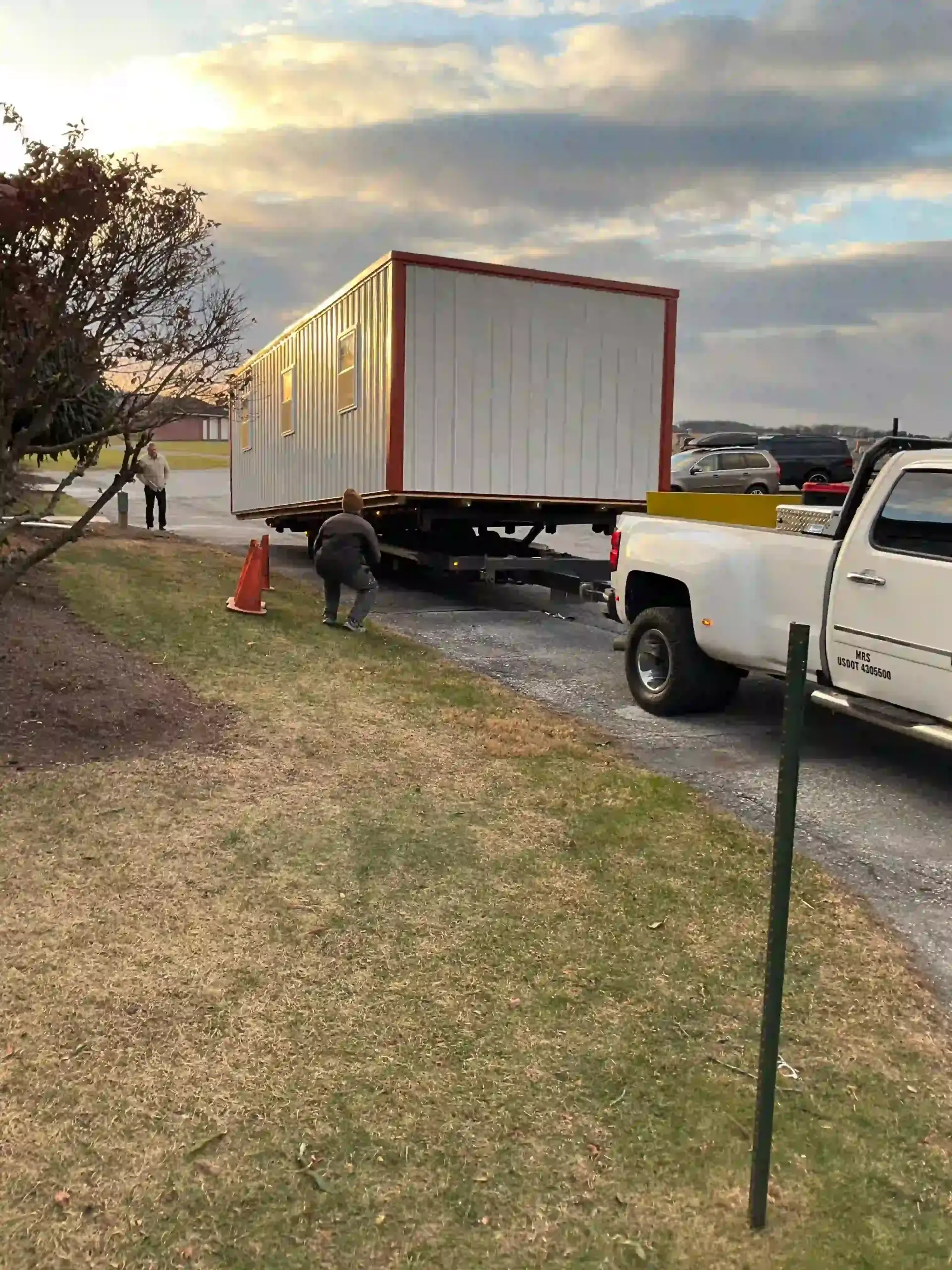 Our expert team carefully guiding a large modular building into its precise final position on a client's property.