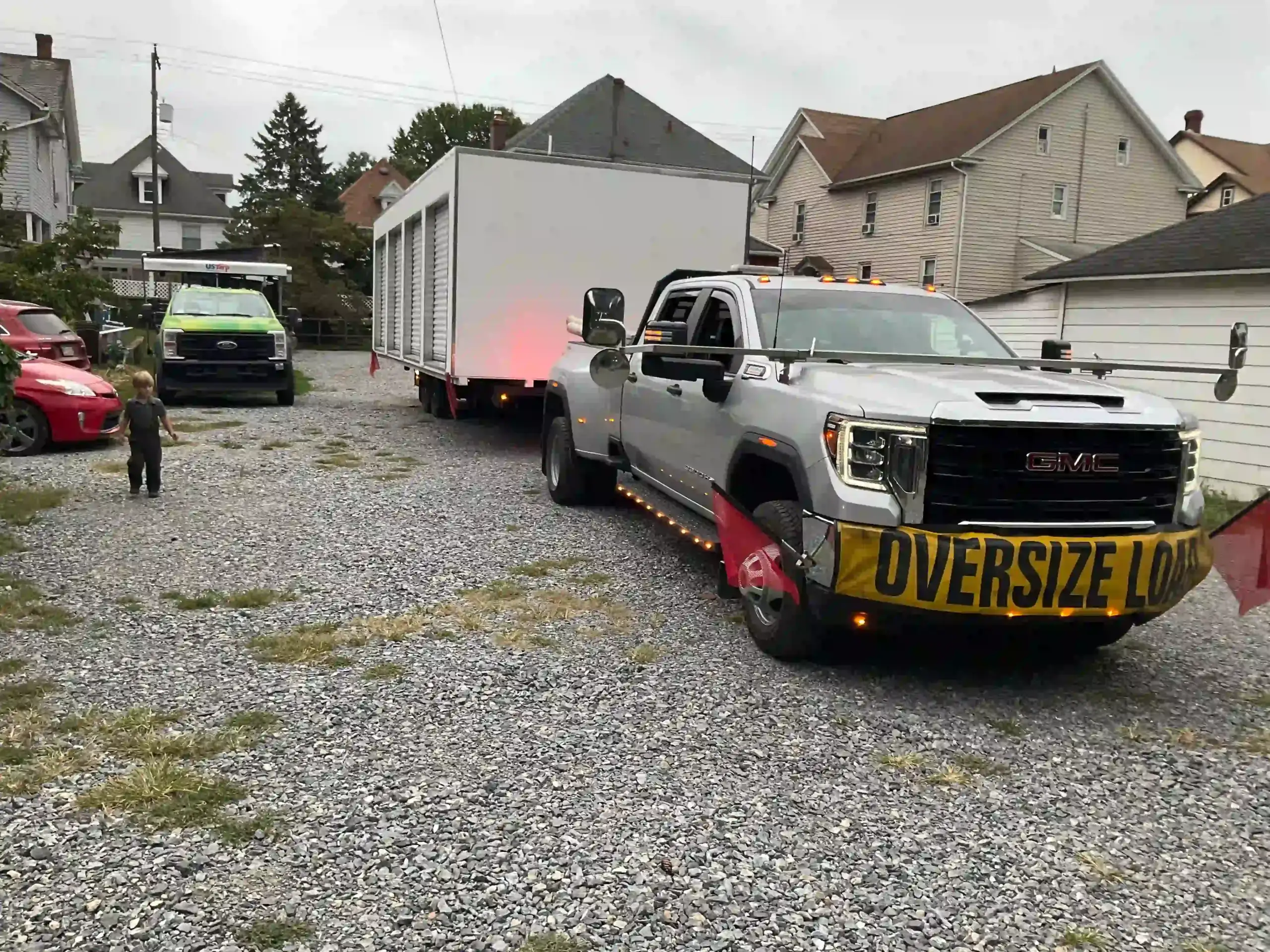 The Mill Run Storage team arriving at a home with an oversize modular building, showcasing our residential delivery capabilities.