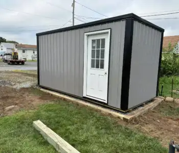 A finished metal portable office installed perfectly on a new foundation, demonstrating our complete site prep and installation services.