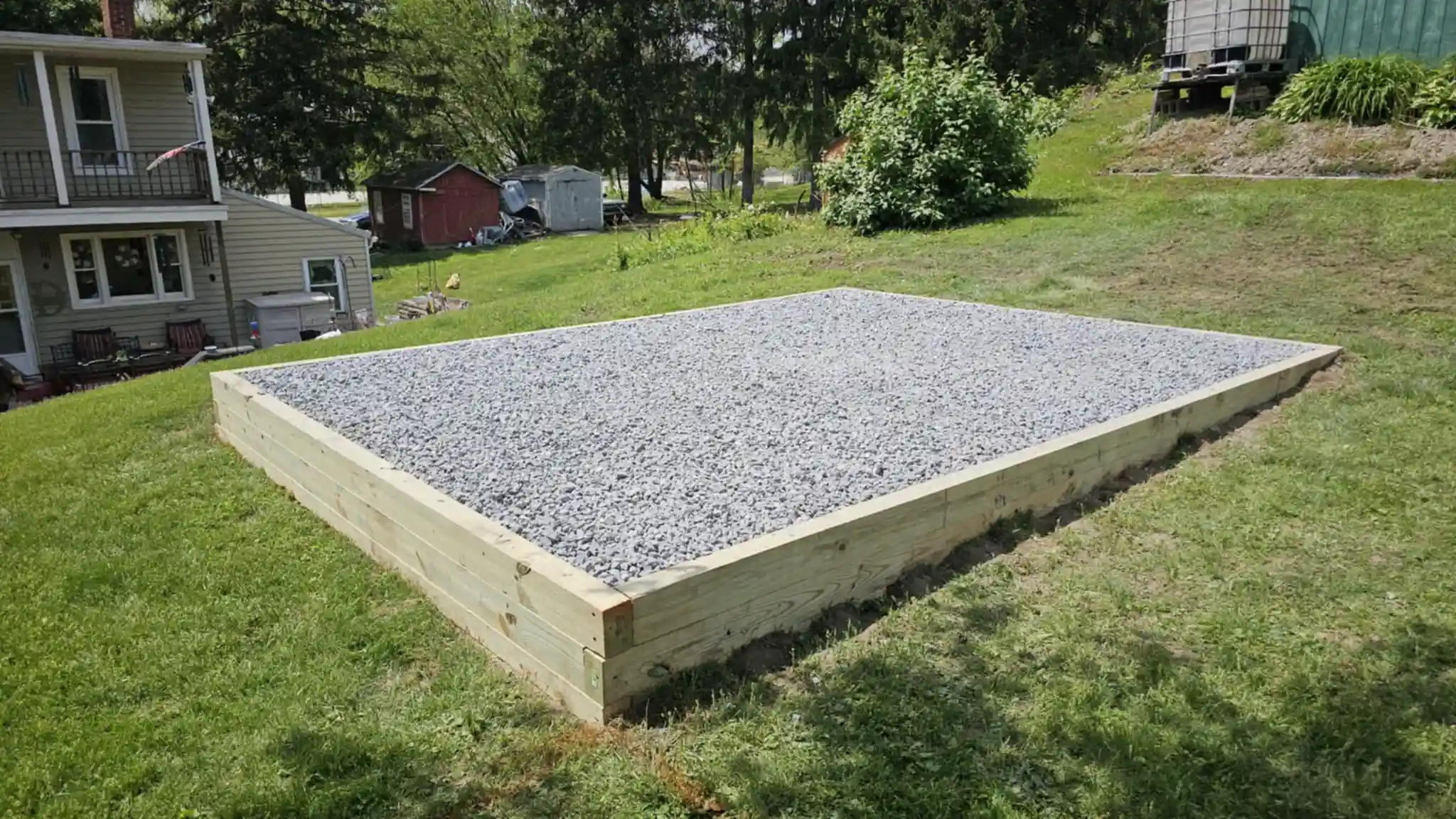 The result of professional site preparation: a sturdy, compacted gravel base ensuring a long-lasting foundation for a storage building or garage.