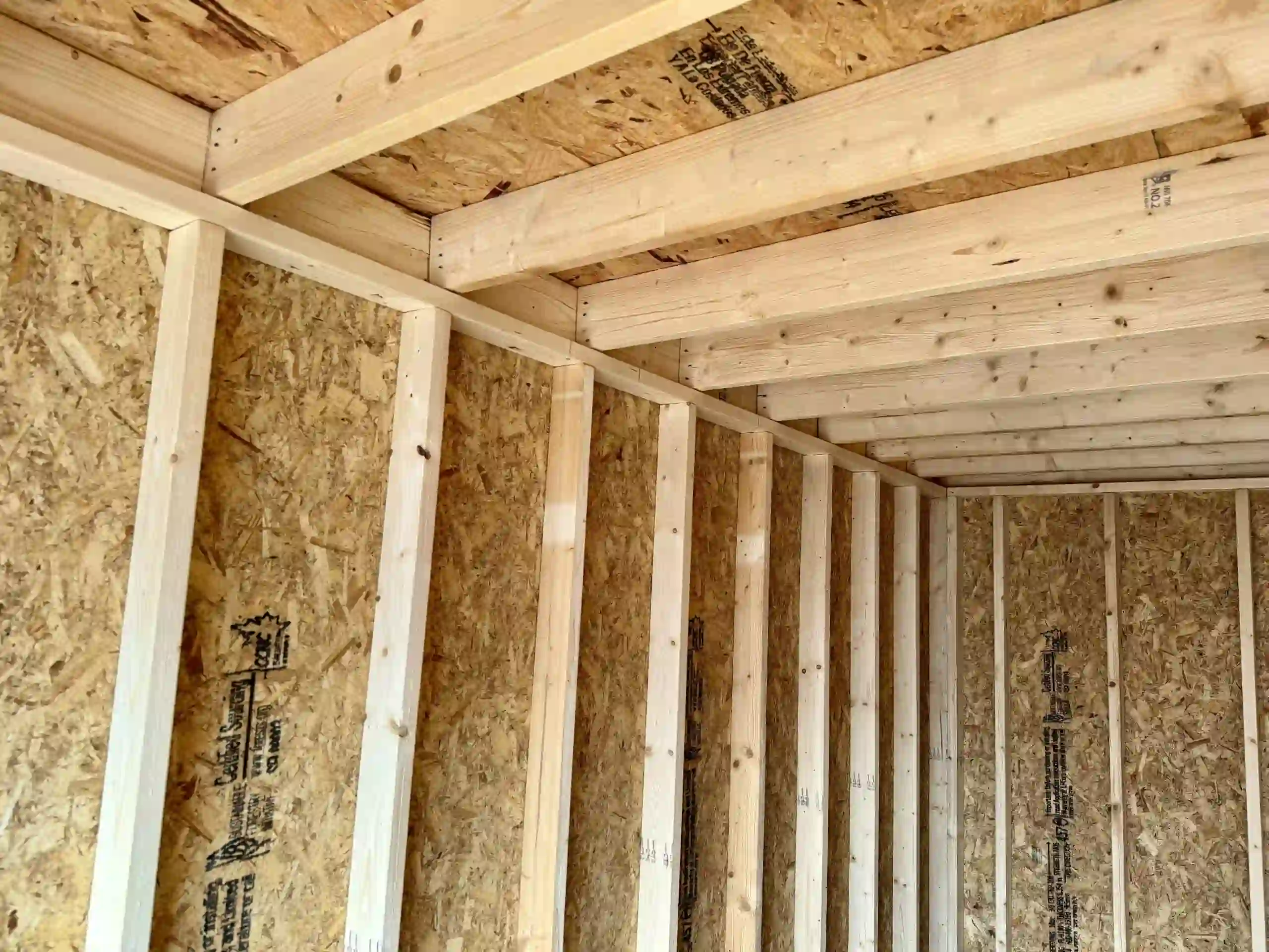 A view of the heavy-duty roof rafters and wall framing inside our portable garages, built for durability.