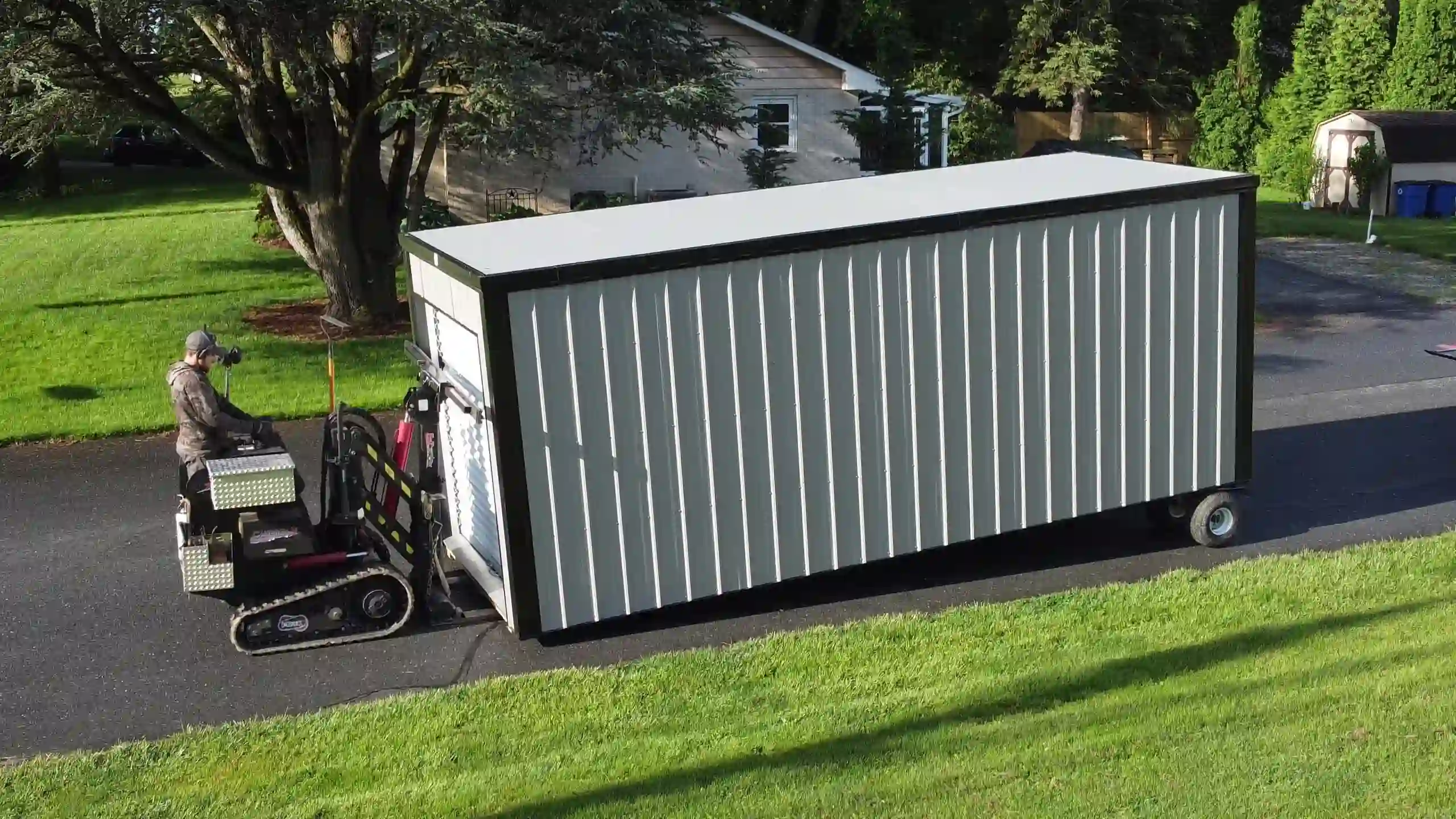 Our tracked shed mover allows for yard-safe delivery across grass without the need for a heavy truck, preventing damage.